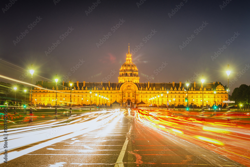 Paris - Les Invalides at night. Traffic light trails and lens flare 