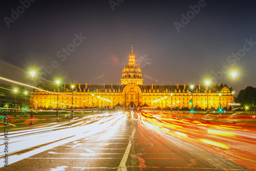 Paris - Les Invalides at night. Traffic light trails and lens flare 