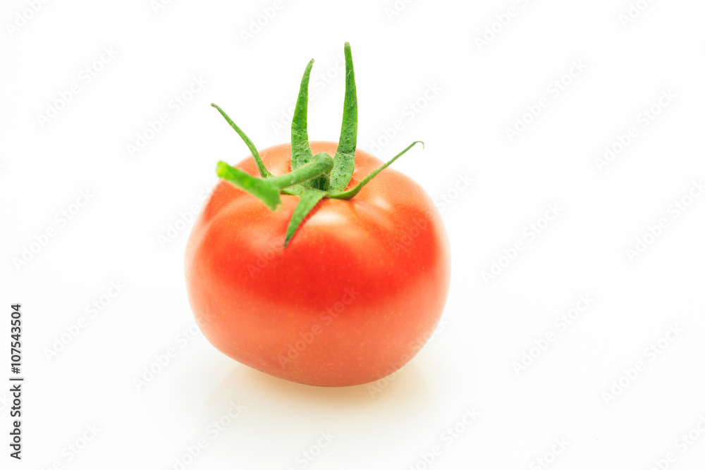 Red fresh tomato with stem, on white background. Red fresh tomato with stem, on white background.