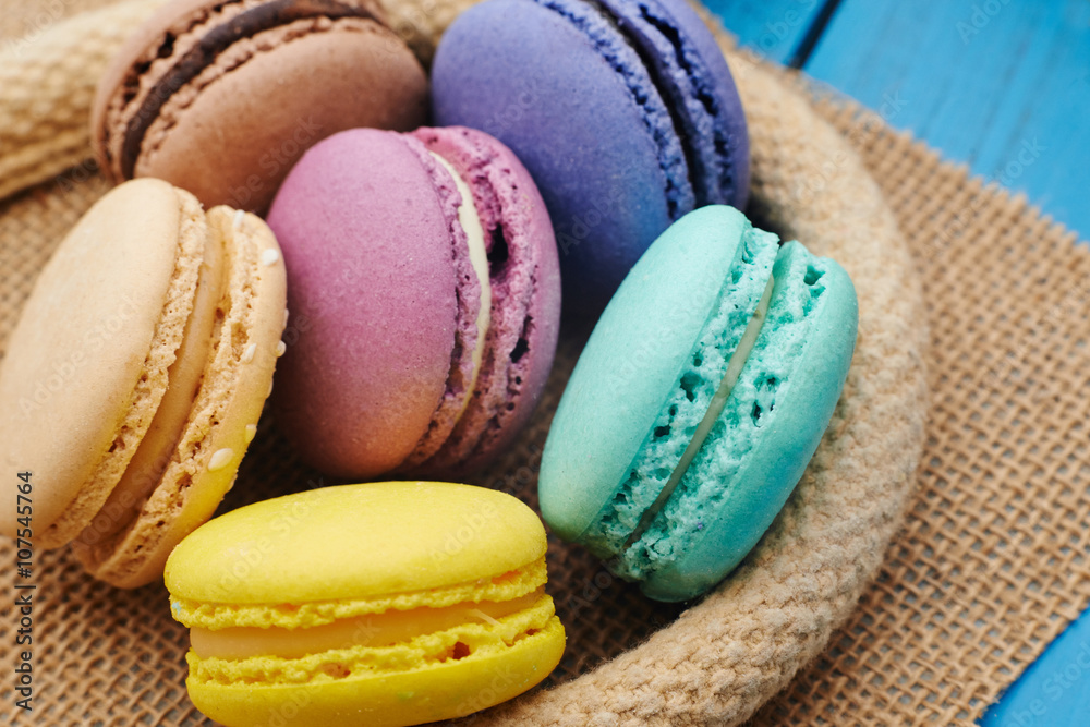 Set of sweets from cookies macaron on table cloths made of textile Set of sweets from cookies macaron on table cloths made of textile
