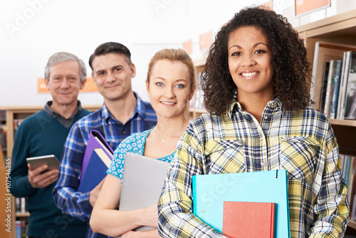 Group Of Mature Students Studying In Library photo