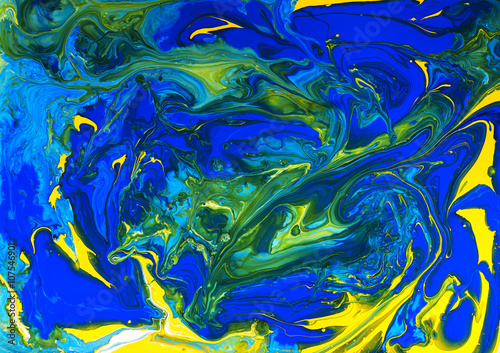 Abstract artistic texture generated using liquid colors and  natural laws of science. Colorful design with a detailed texture of colors mixing in patterns.