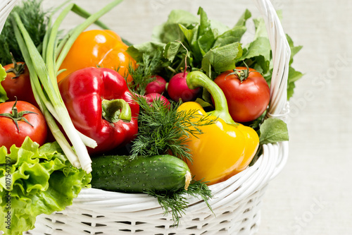Concept of a healthy diet. The basket of vegetables.