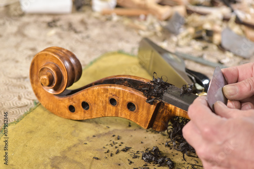 Craftsman working in workshop lutemaker photo