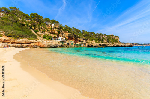Sandy beach in beautiful bay with azure sea water, Cala Llombards, Majorca island, Spain
