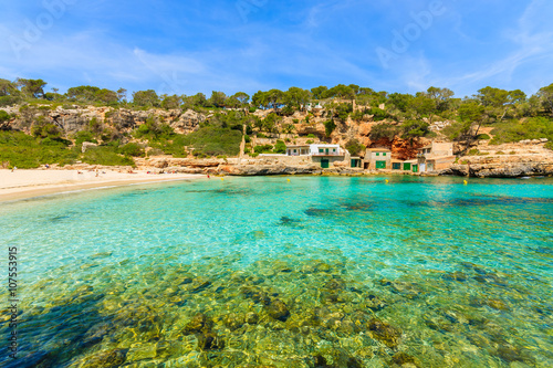 A view of beach with azure sea water, Cala Llombards, Majorca island, Spain
