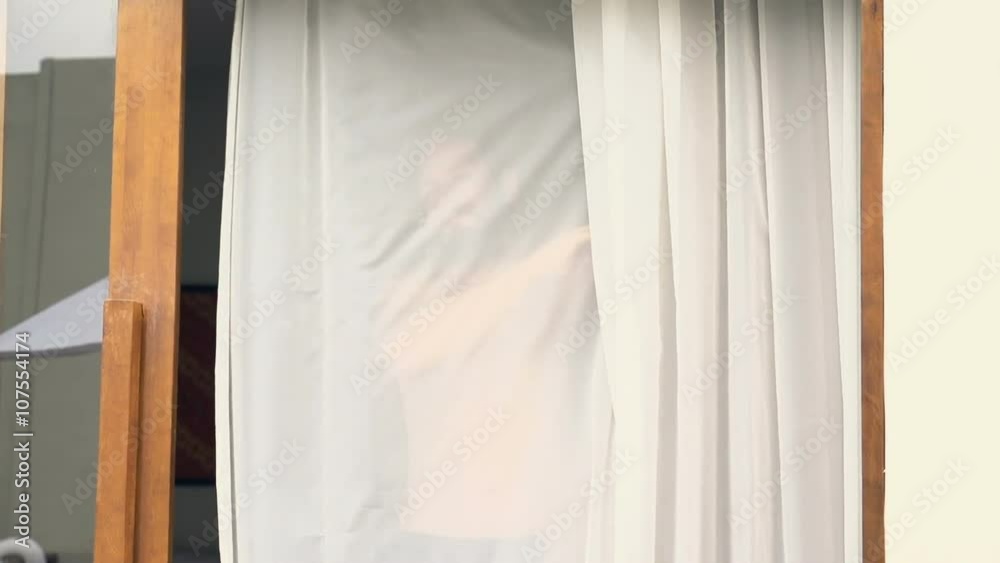 Happy man unveil curtains in room, super slow motion 240fps
Happy man unveil curtains in room, super slow motion 240fps