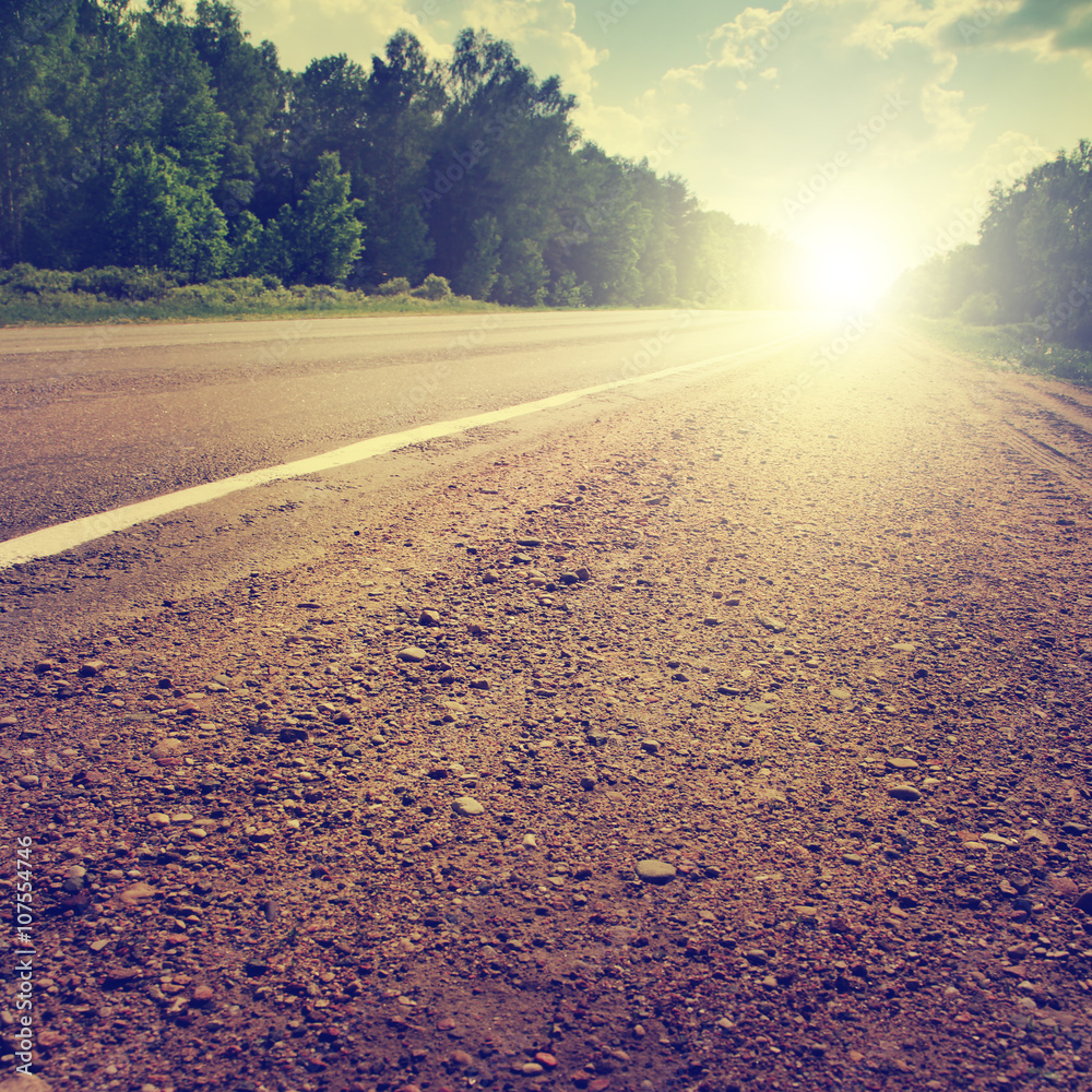 Fototapeta premium Country road at sunset.