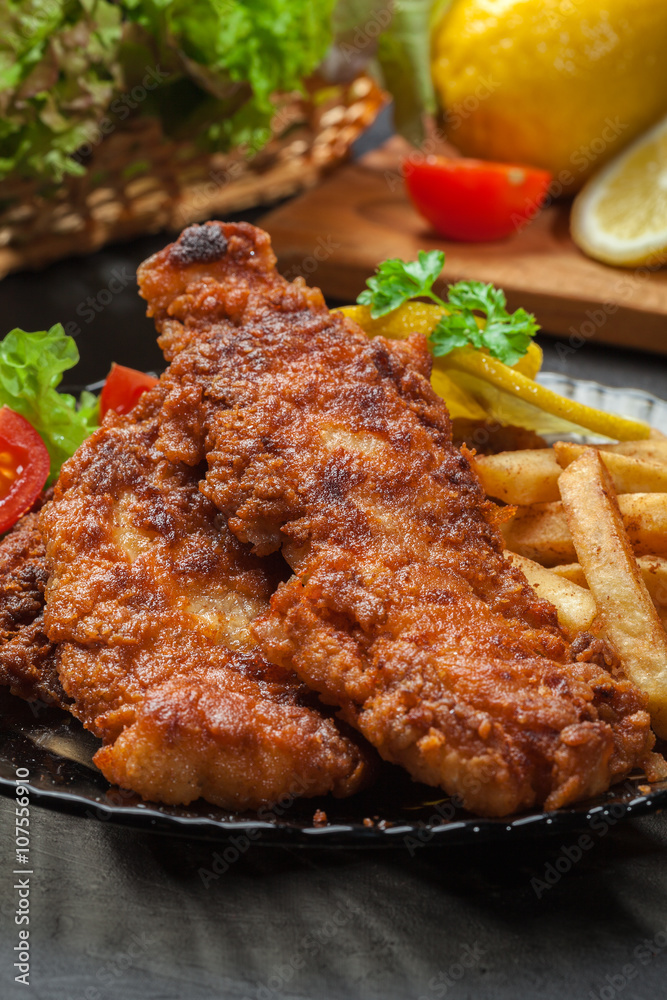 Fried fish in crispy batter with chips Fried fish in crispy batter with chips