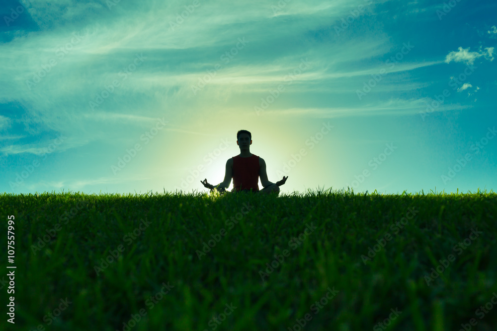Yoga and fitness. Silhouette of man meditating
Yoga and fitness. Silhouette of man meditating