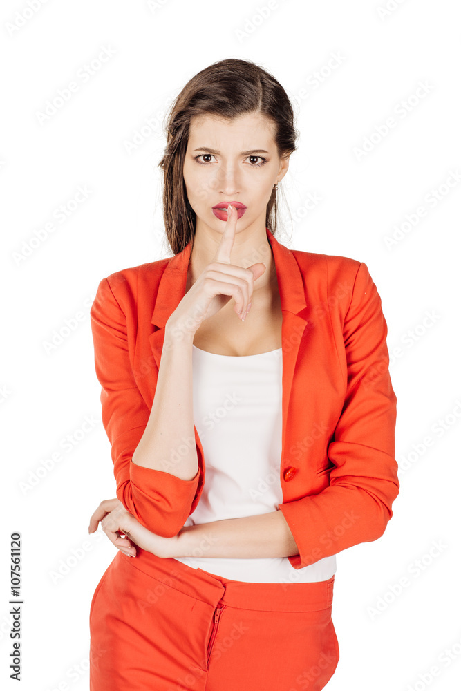 Portrait of young business woman showing hand silence sign, asking someone to keep it quiet. human emotion expression and lifestyle concept. image on a white studio background. Portrait of young business woman showing hand silence sign, asking someone to keep it quiet. human emotion expression and lifestyle concept. image on a white studio background.