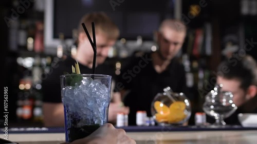 Wallpaper Mural Bartenders at work in the club, prepared alcoholic cocktails, talk to each other.  Torontodigital.ca