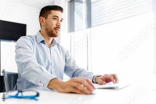 Male office worker sitting at desk