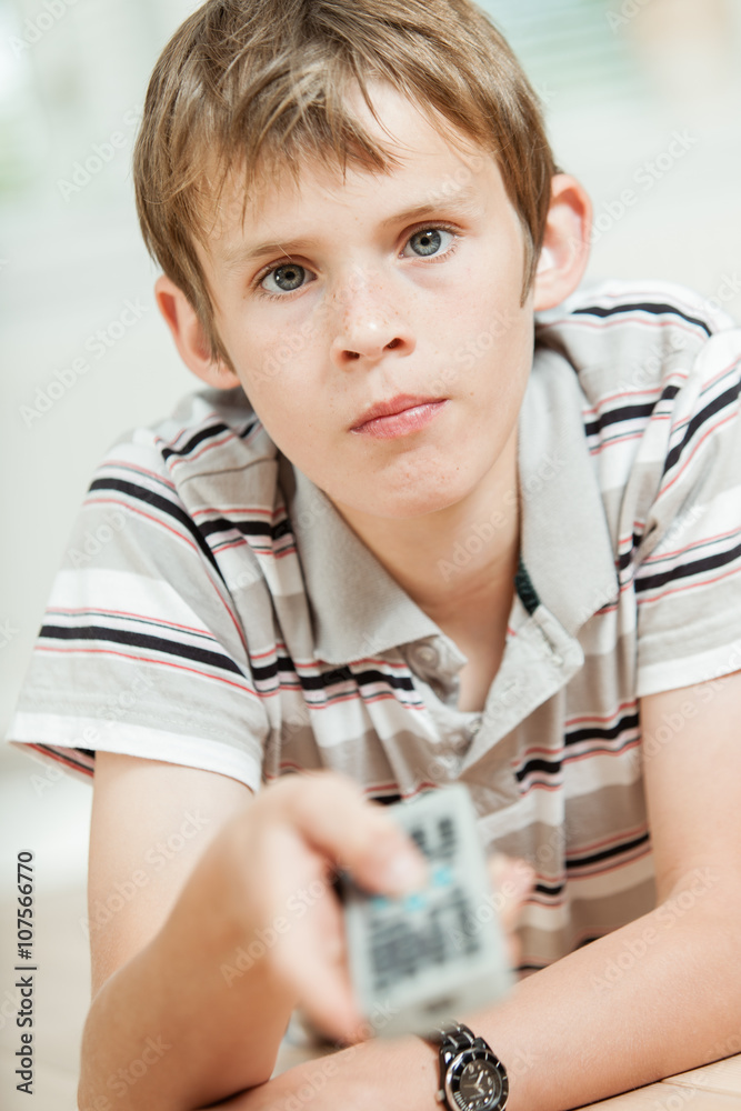 Attractive young boy using a remote control Attractive young boy using a remote control