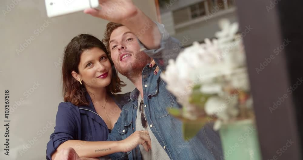 Hipster Woman and Man taking selfie in coffee shop