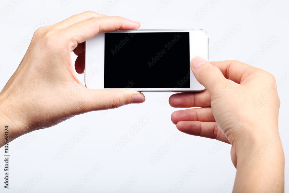 hand touching smart phone isolated on white background. hand touching smart phone isolated on white background.
