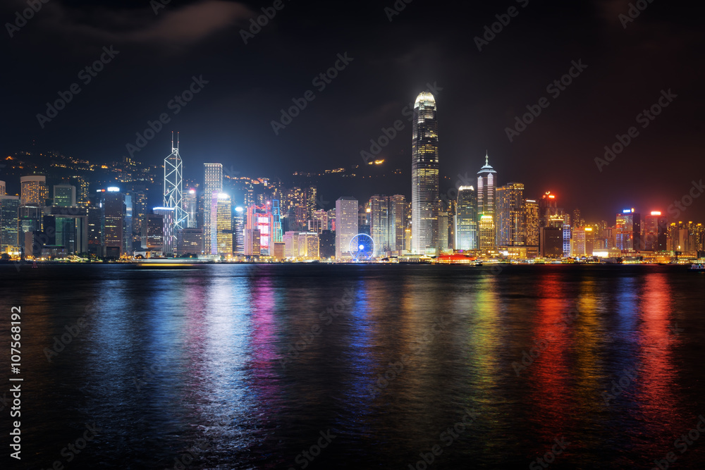 Night view of skyscrapers on waterfront in Hong Kong