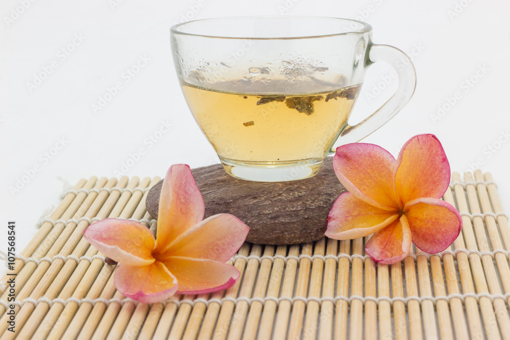 plumeria flower and  cup of tea