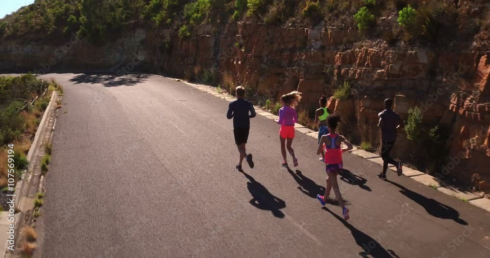 Group of mutli-ethnical athletes running outdoors Group of mutli-ethnical athletes running outdoors