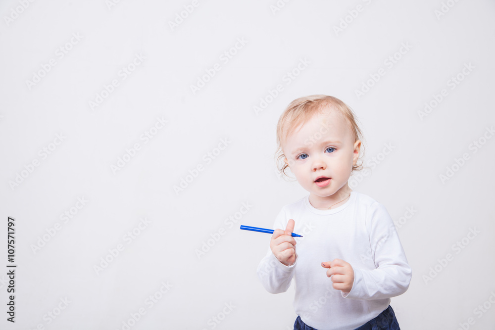 Baby girl drawing with colorful felt-tip pens on white background Baby girl drawing with colorful felt-tip pens on white background