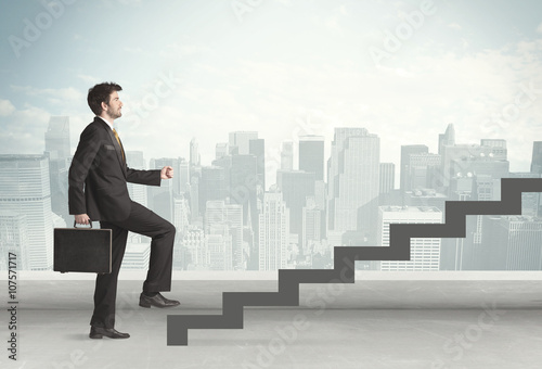 Business person in front of a staircase