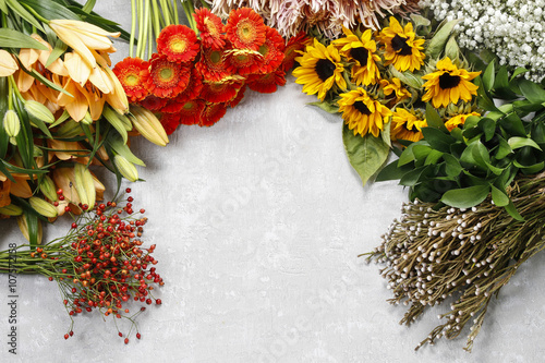 Flowers on a gray stone background, copy space photo