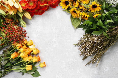 Flowers on a gray stone background, copy space photo