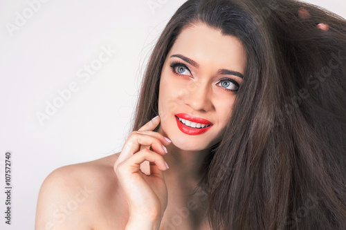 Happy woman with healthy perfect long hair