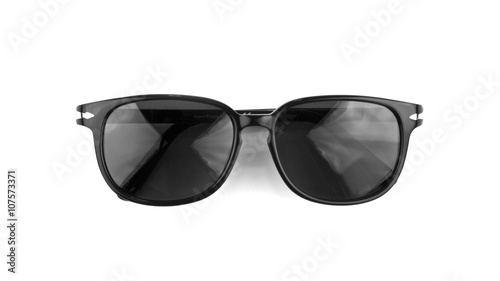 Cool sunglasses isolated on white background. In black plastic frame. Top view. Close up.