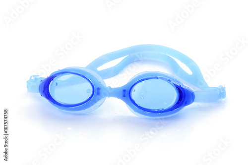 Blue swimming goggles with water drops on white background