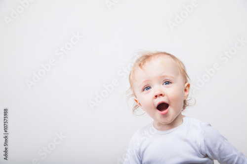 Little girl a on white background. Portrait