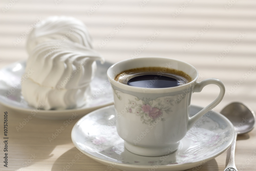 A small cup of black coffee. A small cup of black coffee.