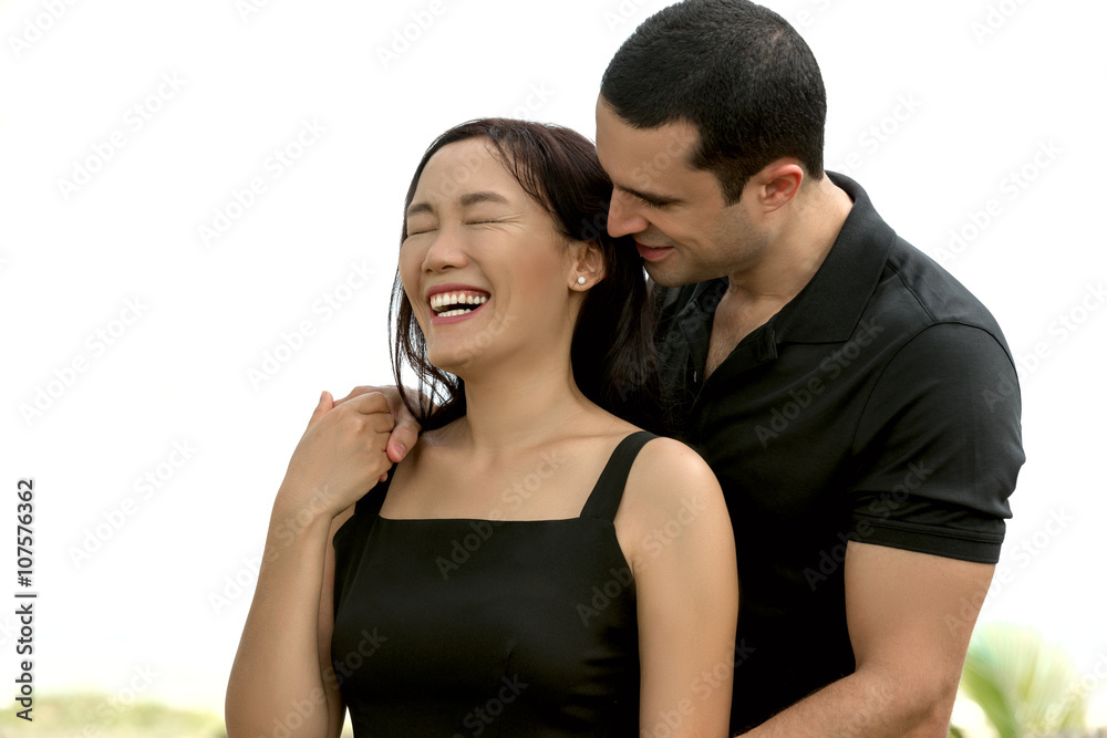 Naklejka premium Portrait of happy interracial couple in love outdoor