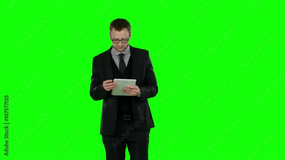 Business man makes online shopping. Green screen. 