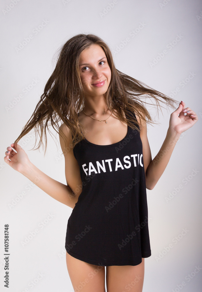 sexy girl in a black T-shirt over his naked body posing Stock Photo | Adobe  Stock