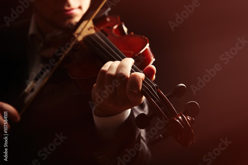 Musician play violin on dar...