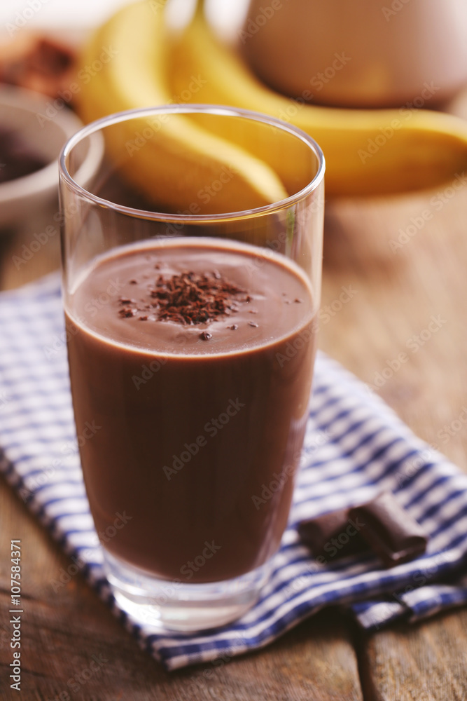 Glass of chocolate milk on table close-up Glass of chocolate milk on table close-up