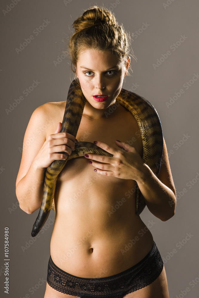 Sexy girl with black-headed python