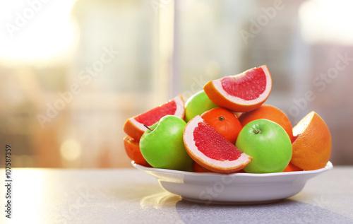 Plate of ripe fruits on a table