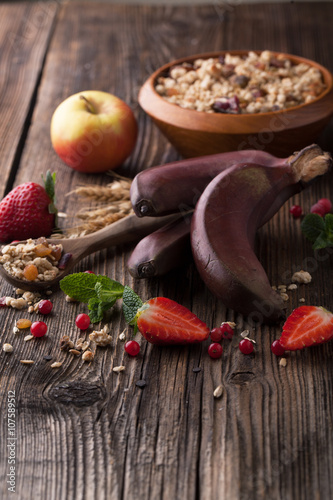 Healthy breakfast of muesli with strawberries, berries, milk and