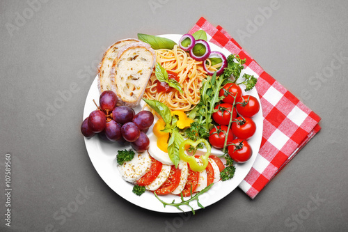 Traditional Italian lunch on brown background