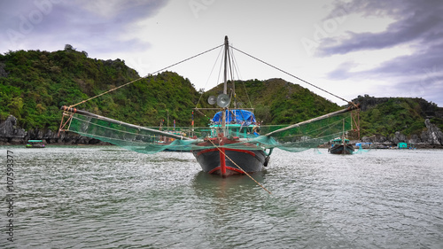 Traditional Vietnamese fishing boats with large nets