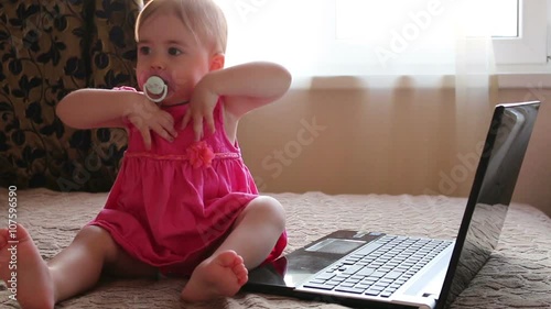 Cute baby working on computer