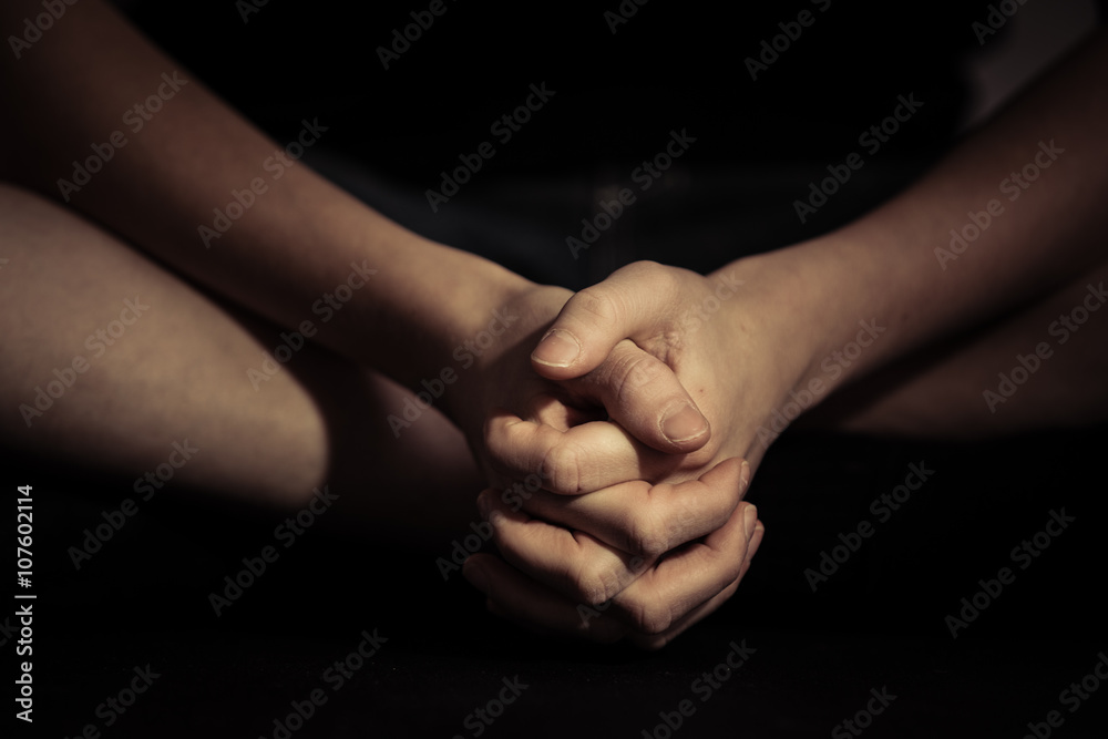 Folded hands in sitting position Folded hands in sitting position