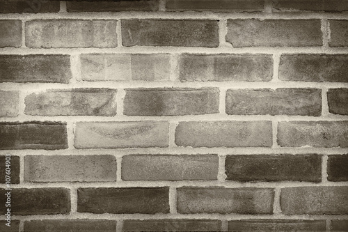 brick wall in sepia and black color huess, trendy urban wall background