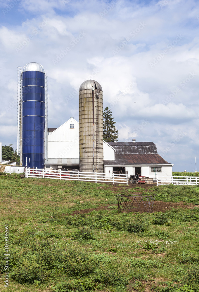 farm house with field and silo