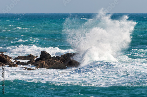 sea waves rolling on stones