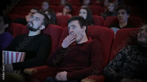 Man falls  aspeep at cinema photo