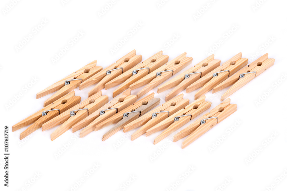 Natural wood clothespins separated on white background Natural wood clothespins separated on white background