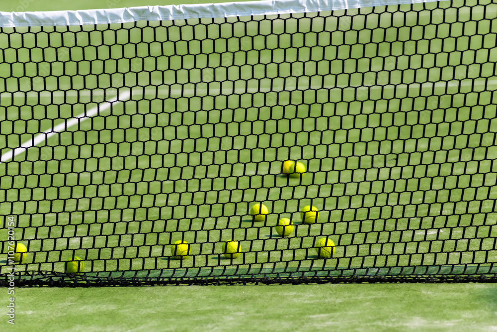 Fototapeta premium Tennis balls on the court.